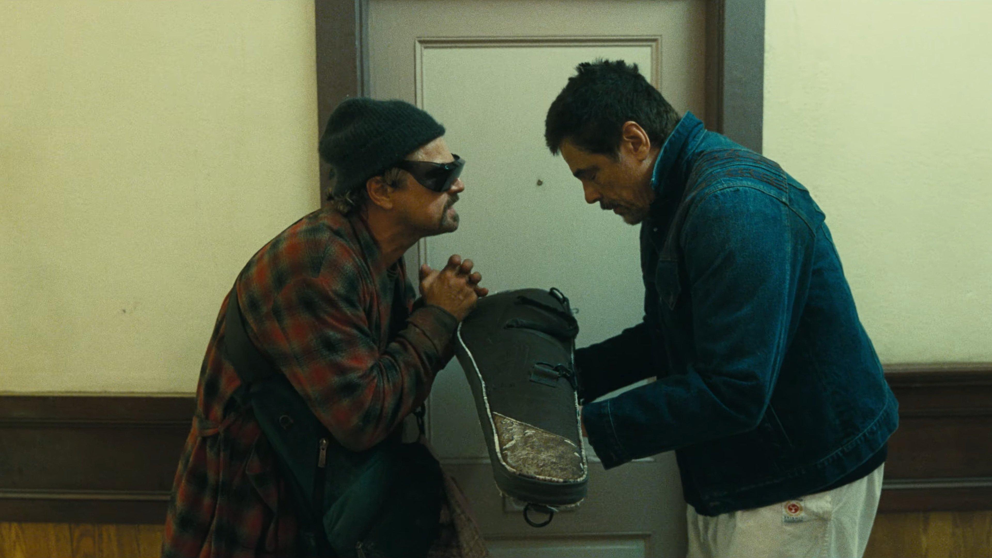 still from One Battle After Another - Leo and Benecio Del Toro